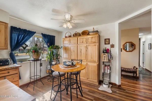 a view of a dining room with furniture and a chandelier