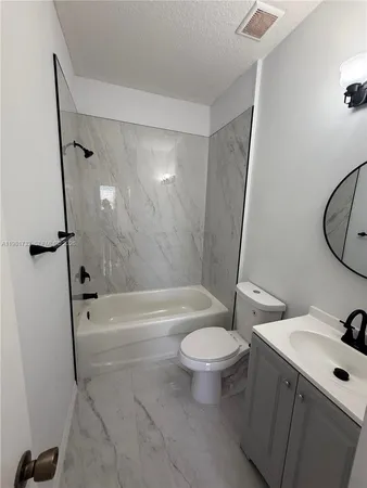 a bathroom with a sink toilet and a bathtub