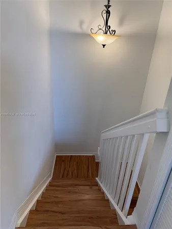 a view of room with wooden floor