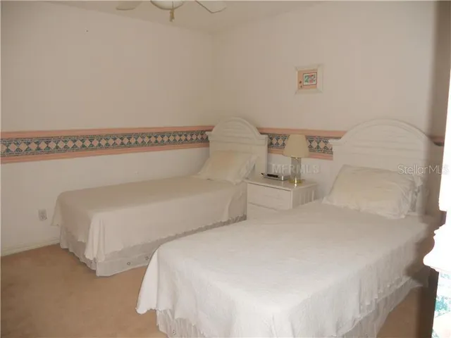 a balcony with chairs and a table