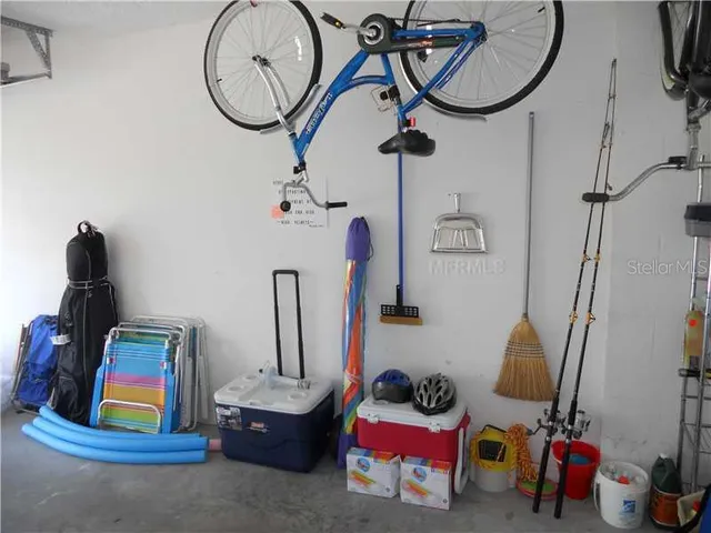 a view of a fountain in front of house and swimming pool