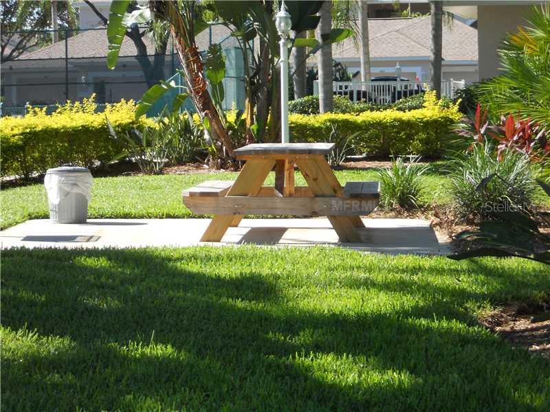 8911 Veranda Way, Unit 222 Sarasota, FL 34238 - Photo 17 of 25 a view of a fountain in front of house and swimming pool