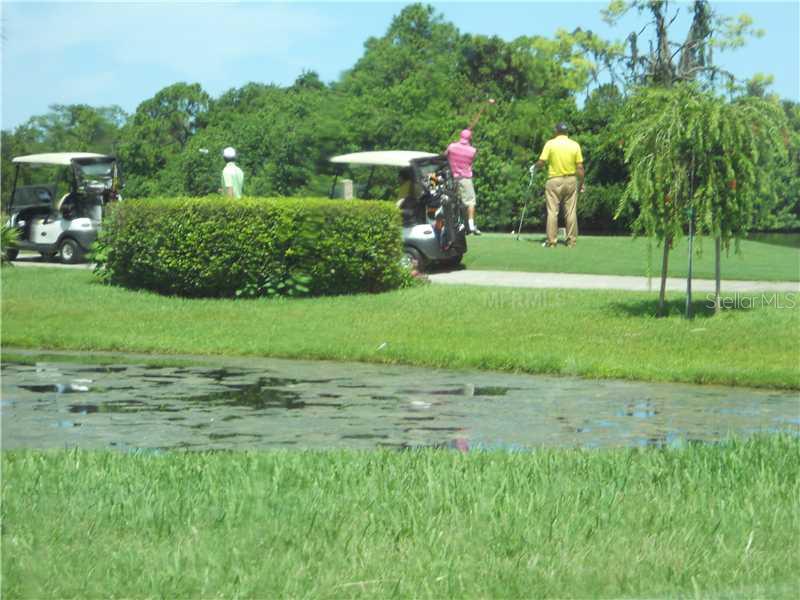 8911 Veranda Way, Unit 222 Sarasota, FL 34238 - Photo 22 of 25 a front view of a house with garden