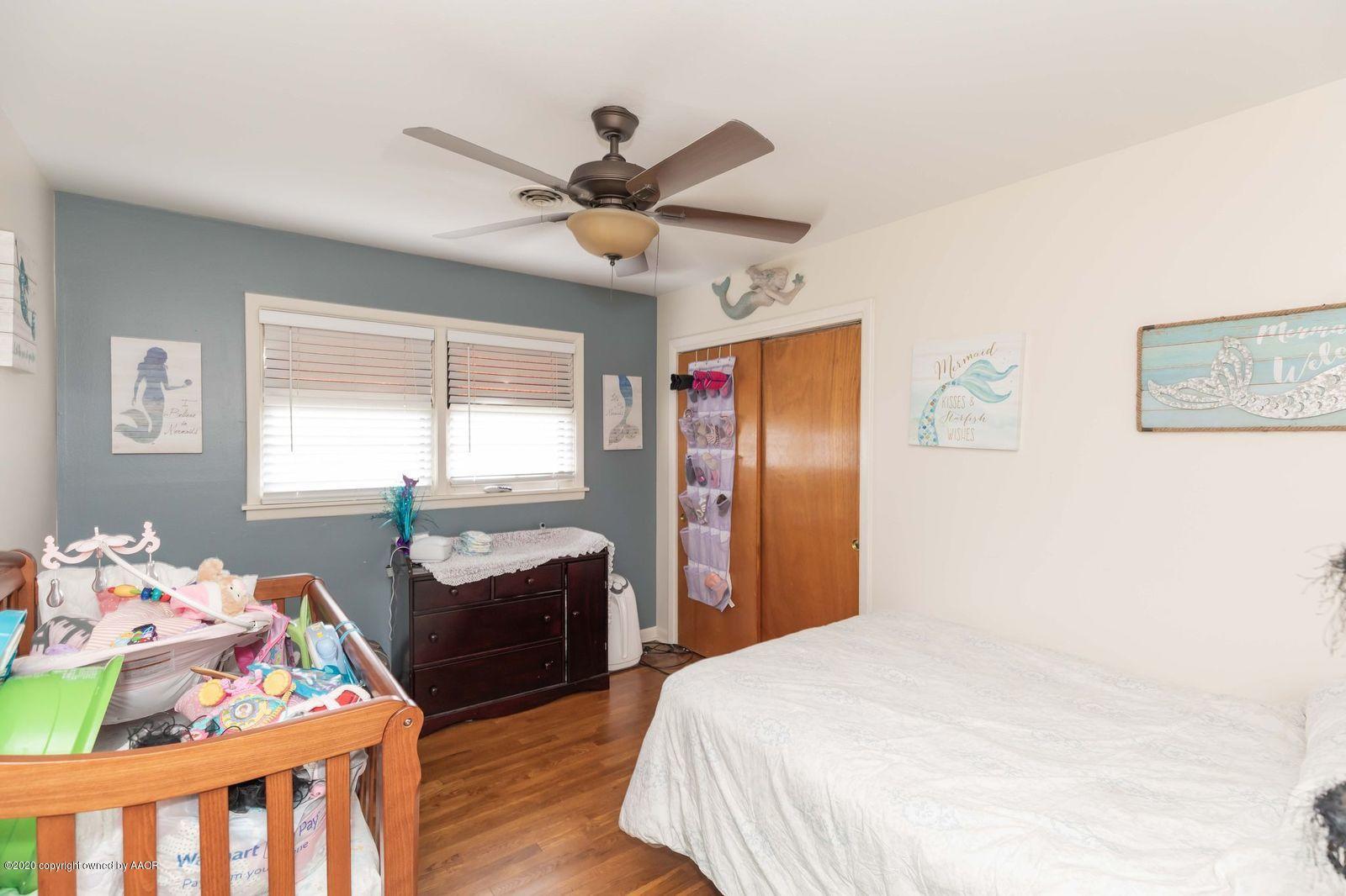 4701 South Milam Street Amarillo, TX 79110 - Photo 23 of 32 a bedroom with double bed and a window