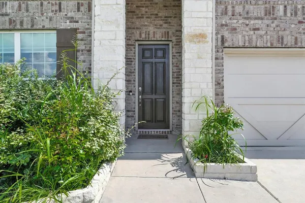 a view of a pathway besides a house