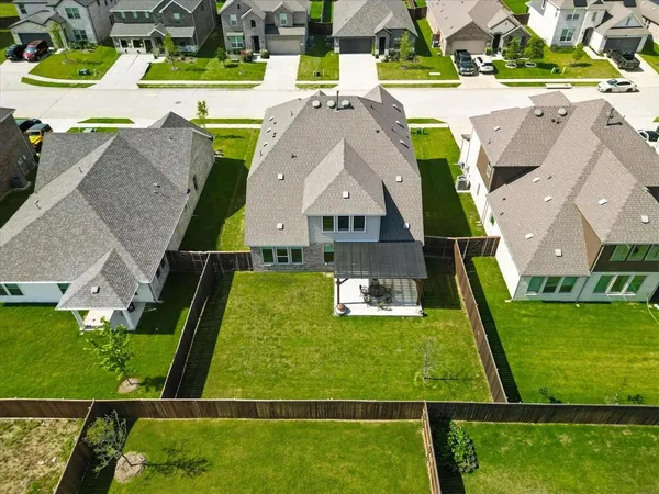 an aerial view of a house with a garden