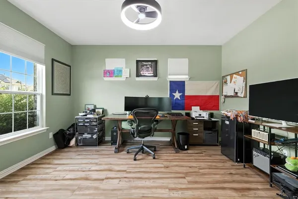 a workspace with furniture hardwood and a window