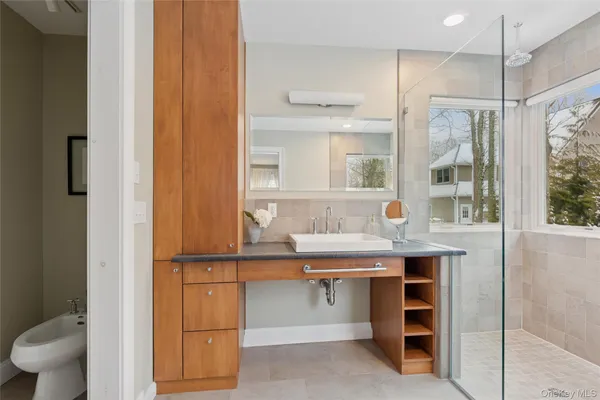 a view of a bathroom with a sink and a mirror