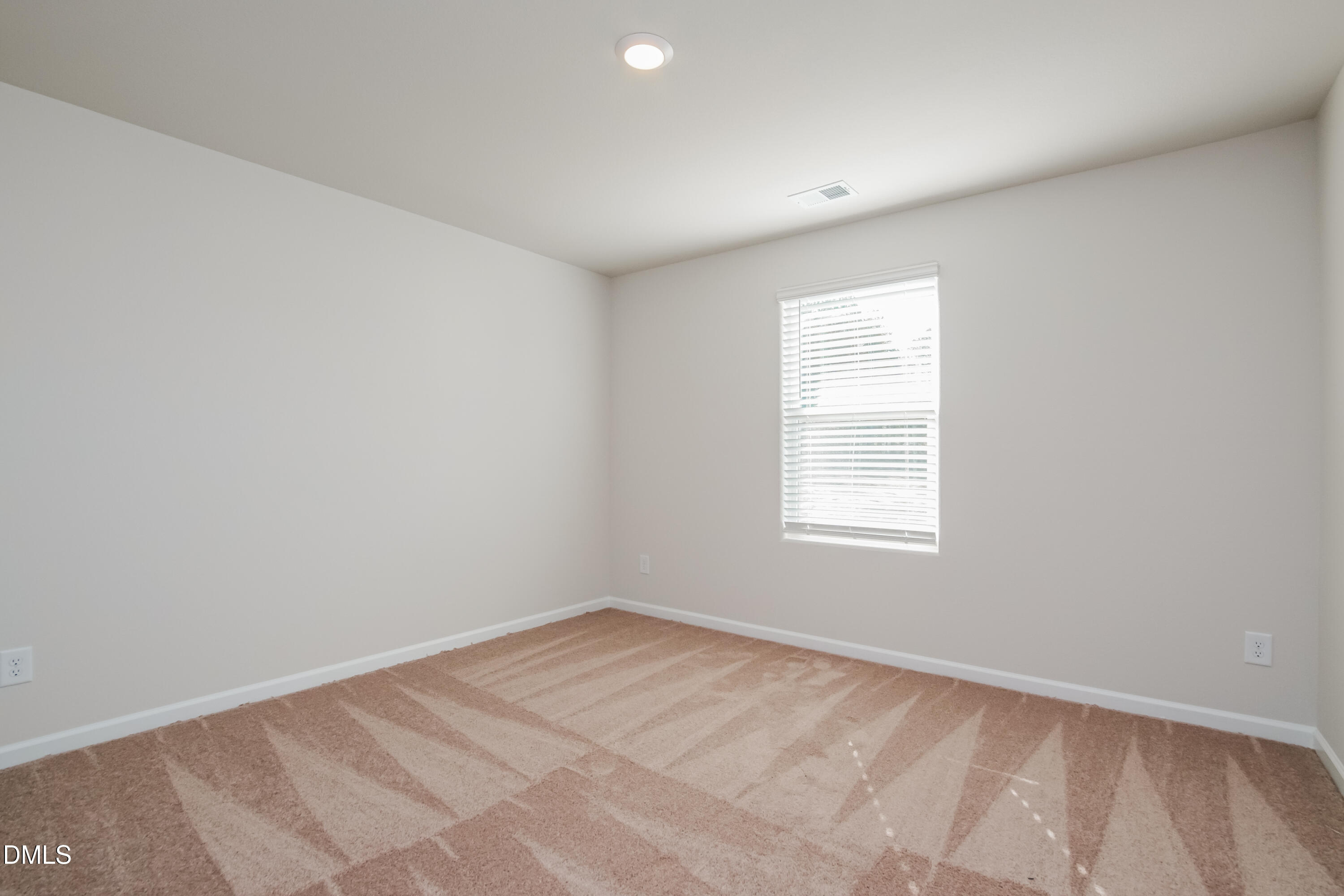 209 Indian Summer Street Zebulon, NC 27597 - Photo 11 of 17 an empty room with a window