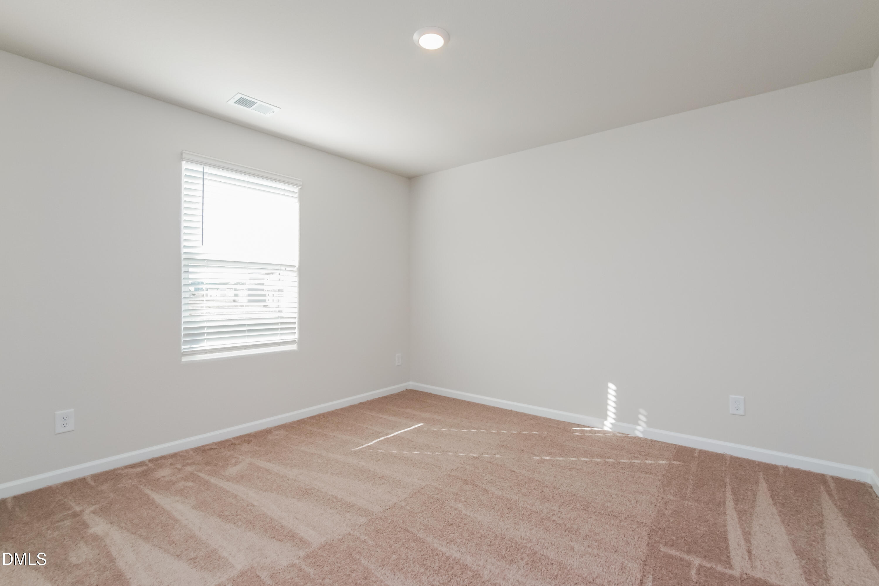 209 Indian Summer Street Zebulon, NC 27597 - Photo 12 of 17 an empty room with a window