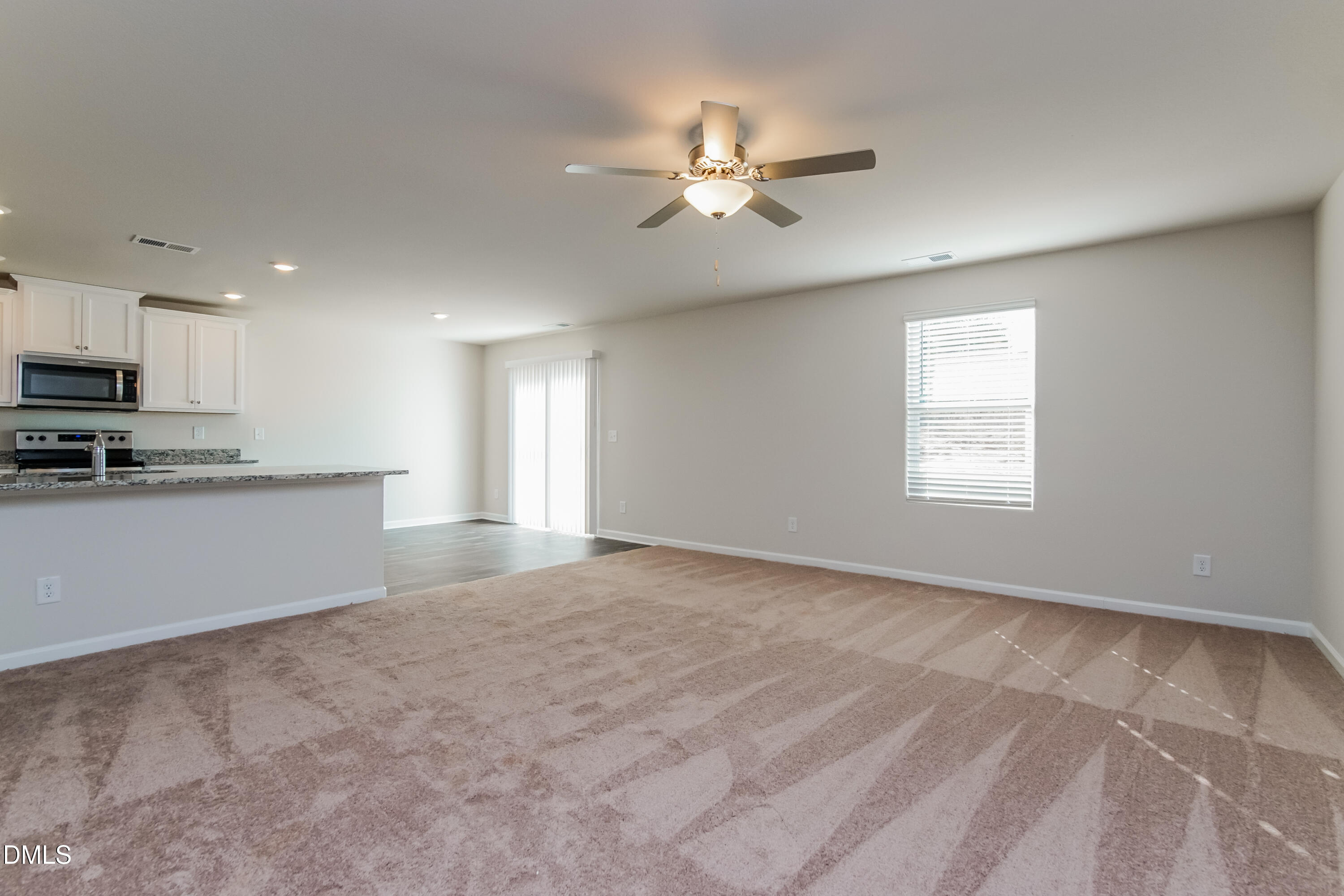 209 Indian Summer Street Zebulon, NC 27597 - Photo 3 of 17 a view of a kitchen with a sink cabinets and window