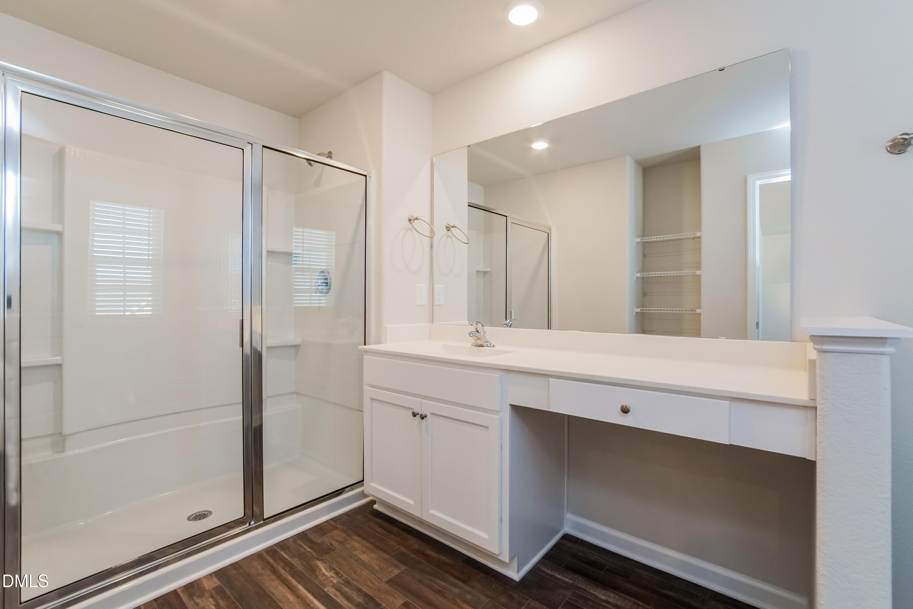 209 Indian Summer Street Zebulon, NC 27597 - Photo 10 of 17 a bathroom with a shower and a sink