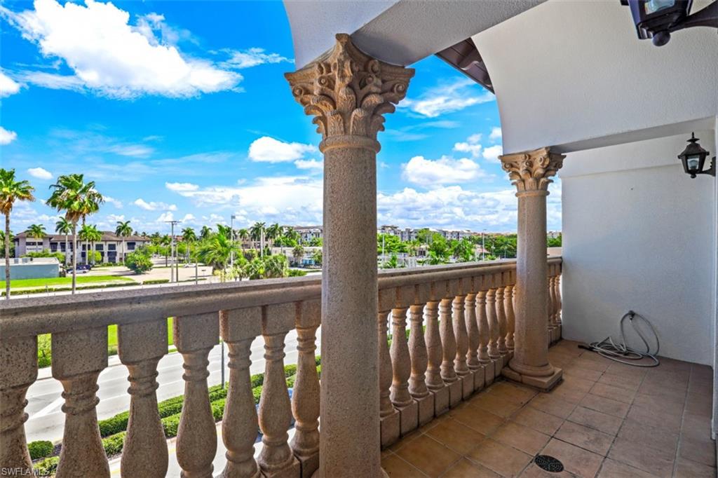 900 5th Avenue South, Unit 301 Naples, FL 34102 - Photo 16 of 17 a view of a porch with a floor to ceiling window fire pit and outdoor seating