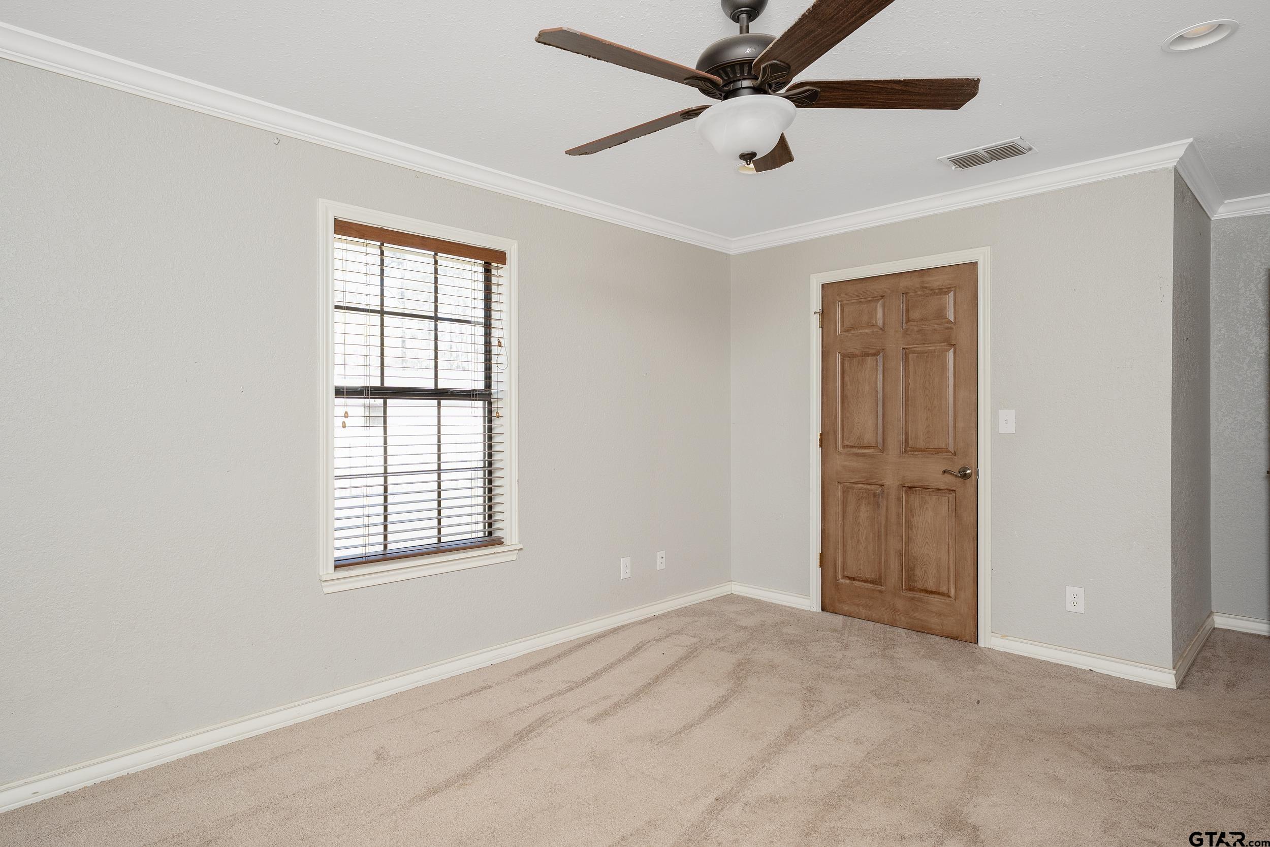 3481 Loop 343 Rusk, TX 75785 - Photo 19 of 48 an empty room with windows and fan