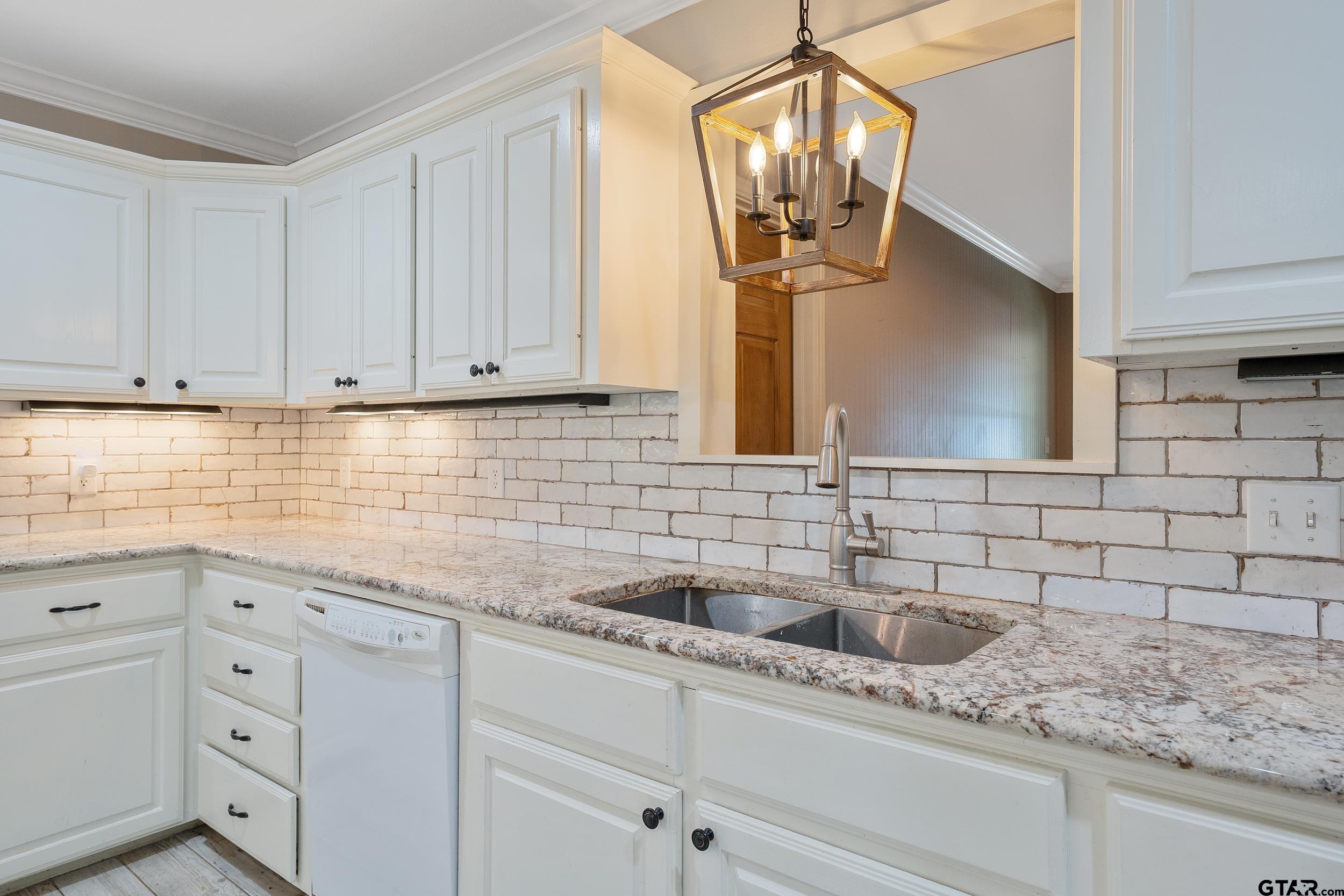 3481 Loop 343 Rusk, TX 75785 - Photo 28 of 48 a kitchen with a sink and cabinets