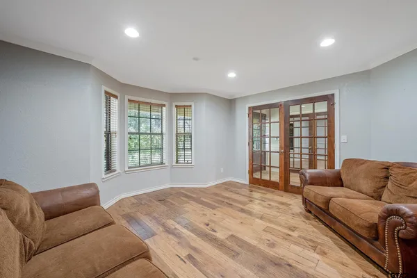 a bedroom with furniture and windows