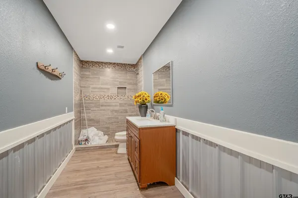 a view of hallway with wooden floor
