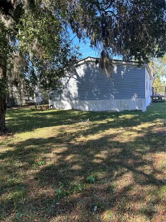 a view of a lake with a big yard