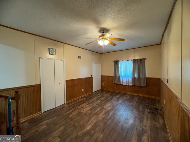 a view of a livingroom with wooden floor