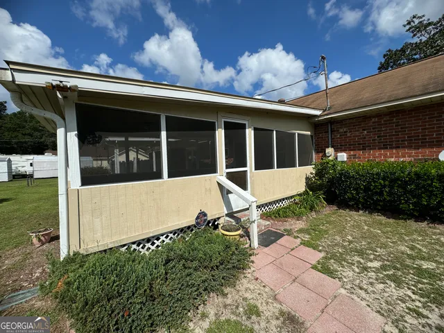 a view of a backyard with a garden