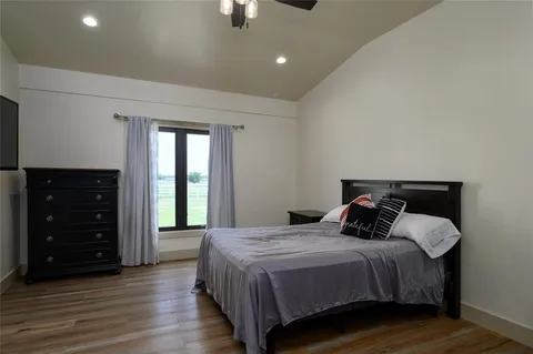 a bathroom with a granite countertop sink a potted plant and a window