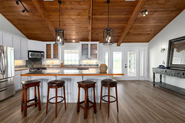 a hallway with a couch and chandelier