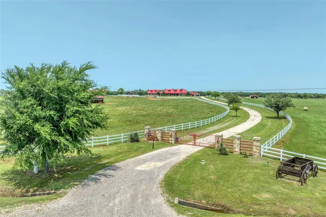 a view of a swimming pool with a yard