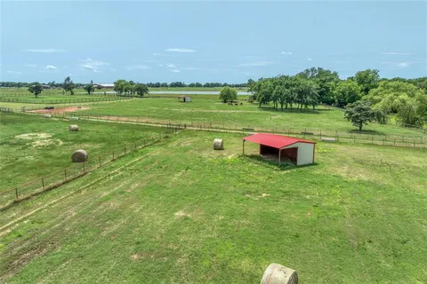a view of a field with an ocean