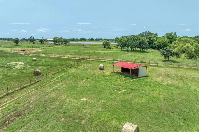 a view of a field with an ocean
