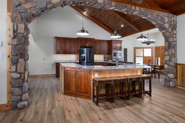 a outdoor dining space with furniture and wooden floor