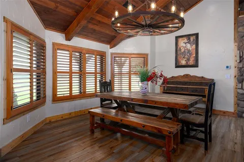 a view of a room with furniture window and wooden floor