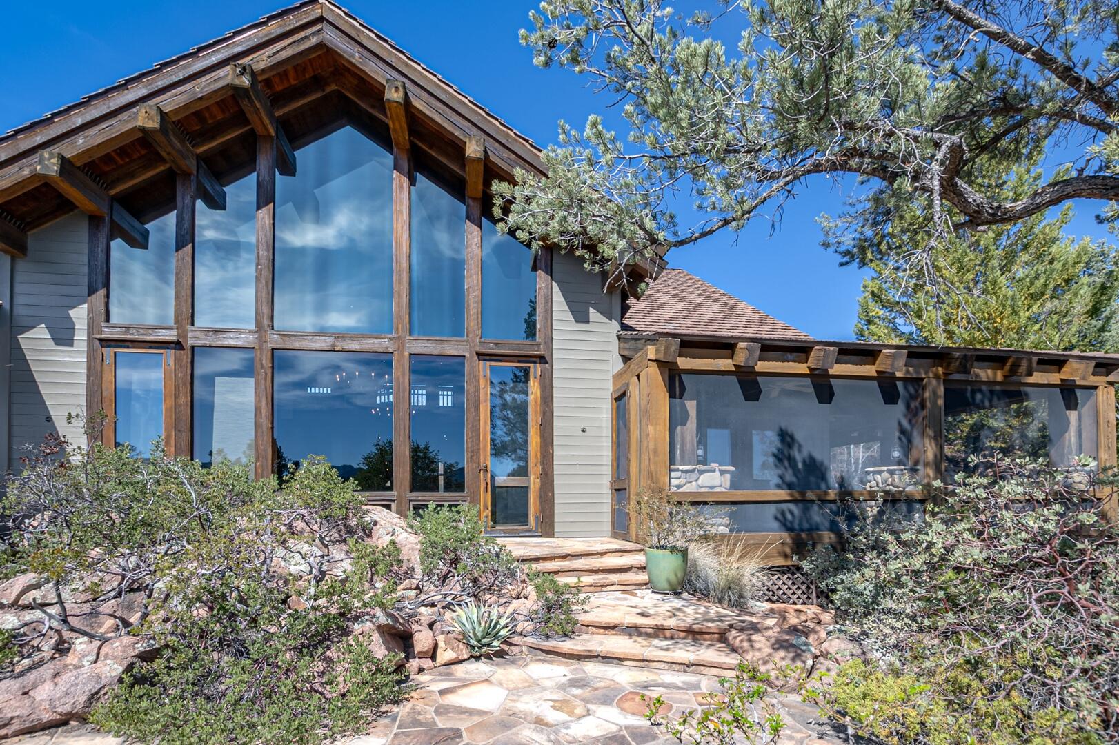 2401 East Rim Club Drive Payson, AZ 85541 - Photo 70 of 116 Great room windows and screen porch on righ