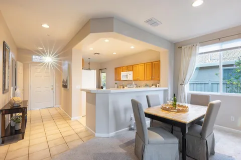 a kitchen with a table and chairs in it