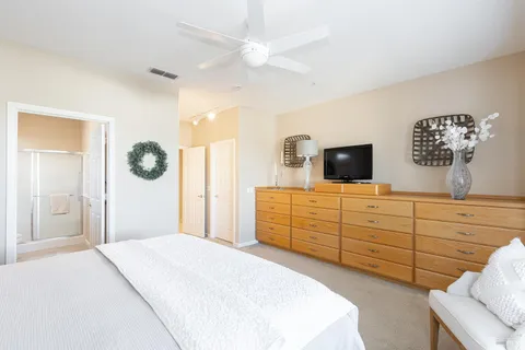 a bedroom with a bed and a dresser