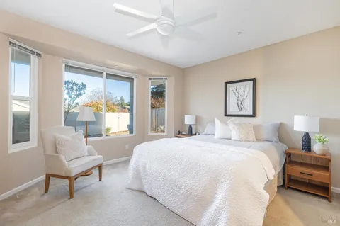 a bedroom with a bed and a couch