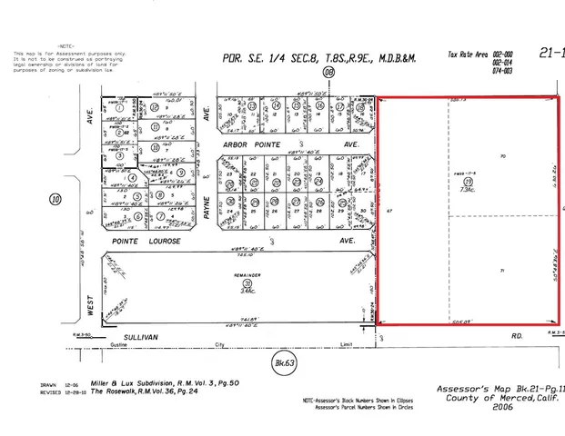 an aerial view of lake and residential houses with outdoor space