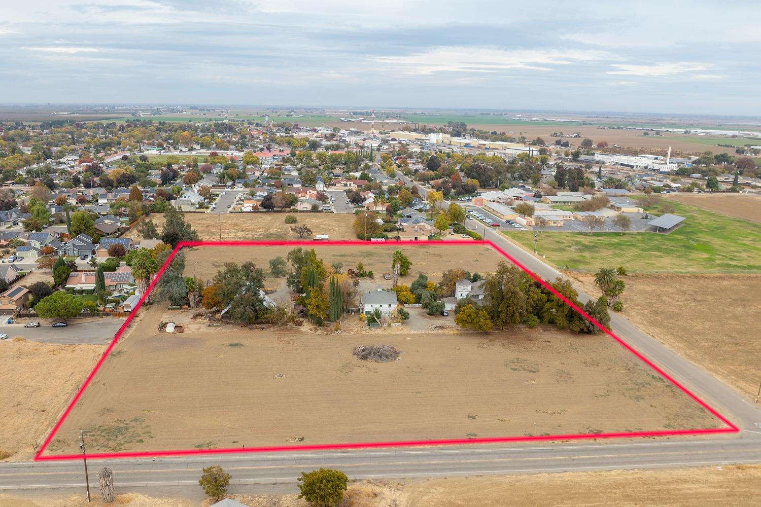 2939 Grove Avenue Gustine, CA 95322 - Photo 9 of 9 an aerial view of residential houses with outdoor space