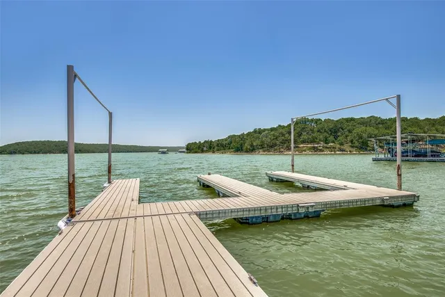 a view of a lake with a yard