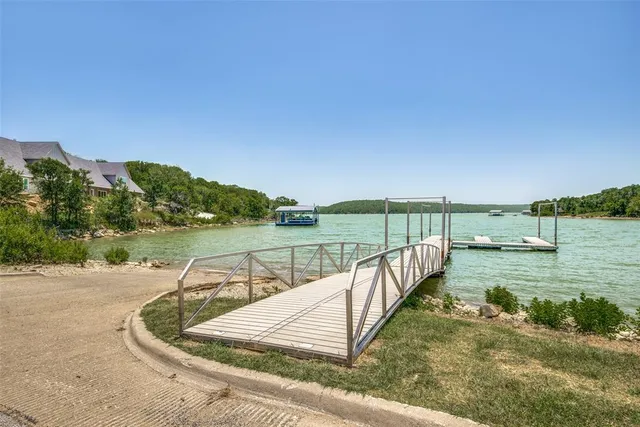 a view of a lake with a yard