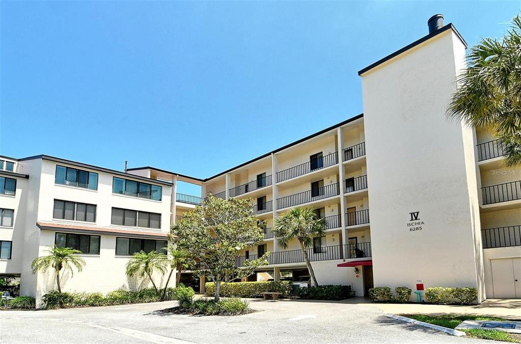 6285 Midnight Pass Road, Unit 403 Sarasota, FL 34242 - Photo 24 of 51 a front view of a building with street view