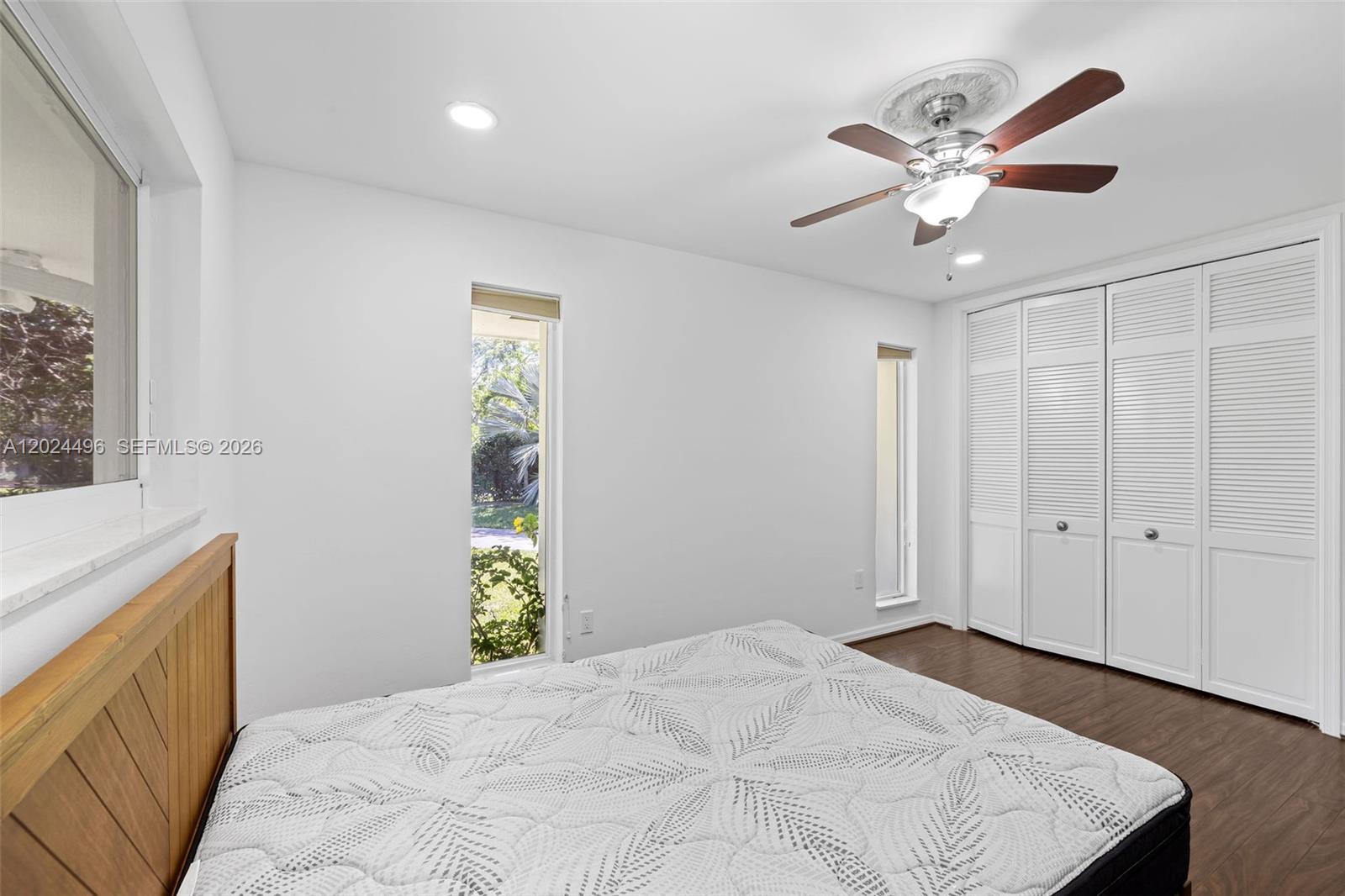 6875 North Cartee Road Palmetto Bay, FL 33158 - Photo 28 of 42 a bedroom with a bed and a window