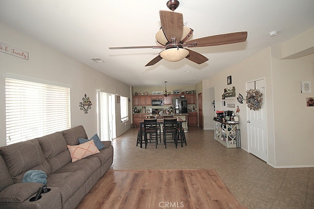 924 Condor Street Barstow, CA 92311 - Photo 12 of 52 a living room with furniture and a large window