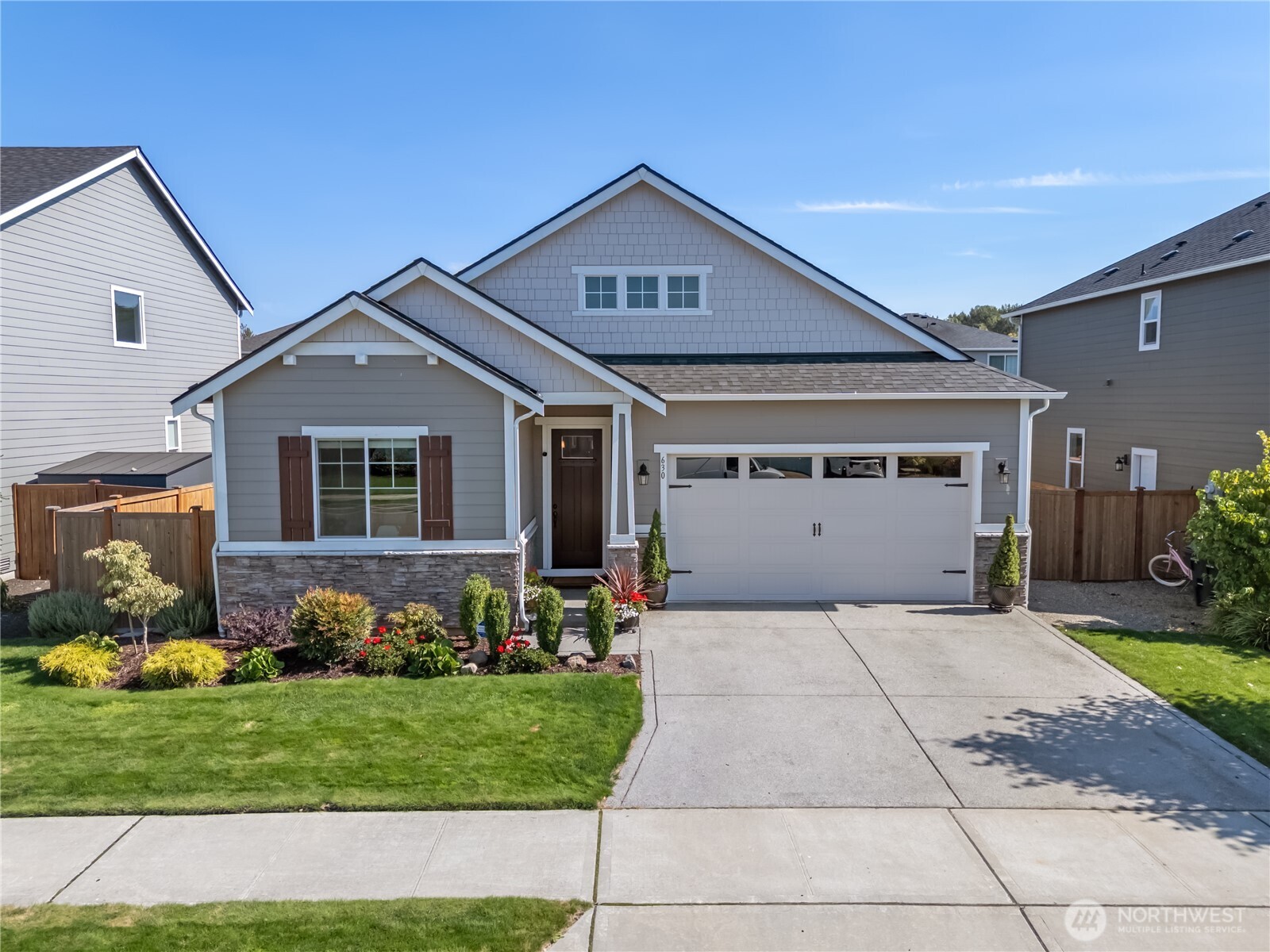 630 South Knowles Street Buckley, WA 98321 - Photo 1 of 29 a front view of a house with a garden and plants