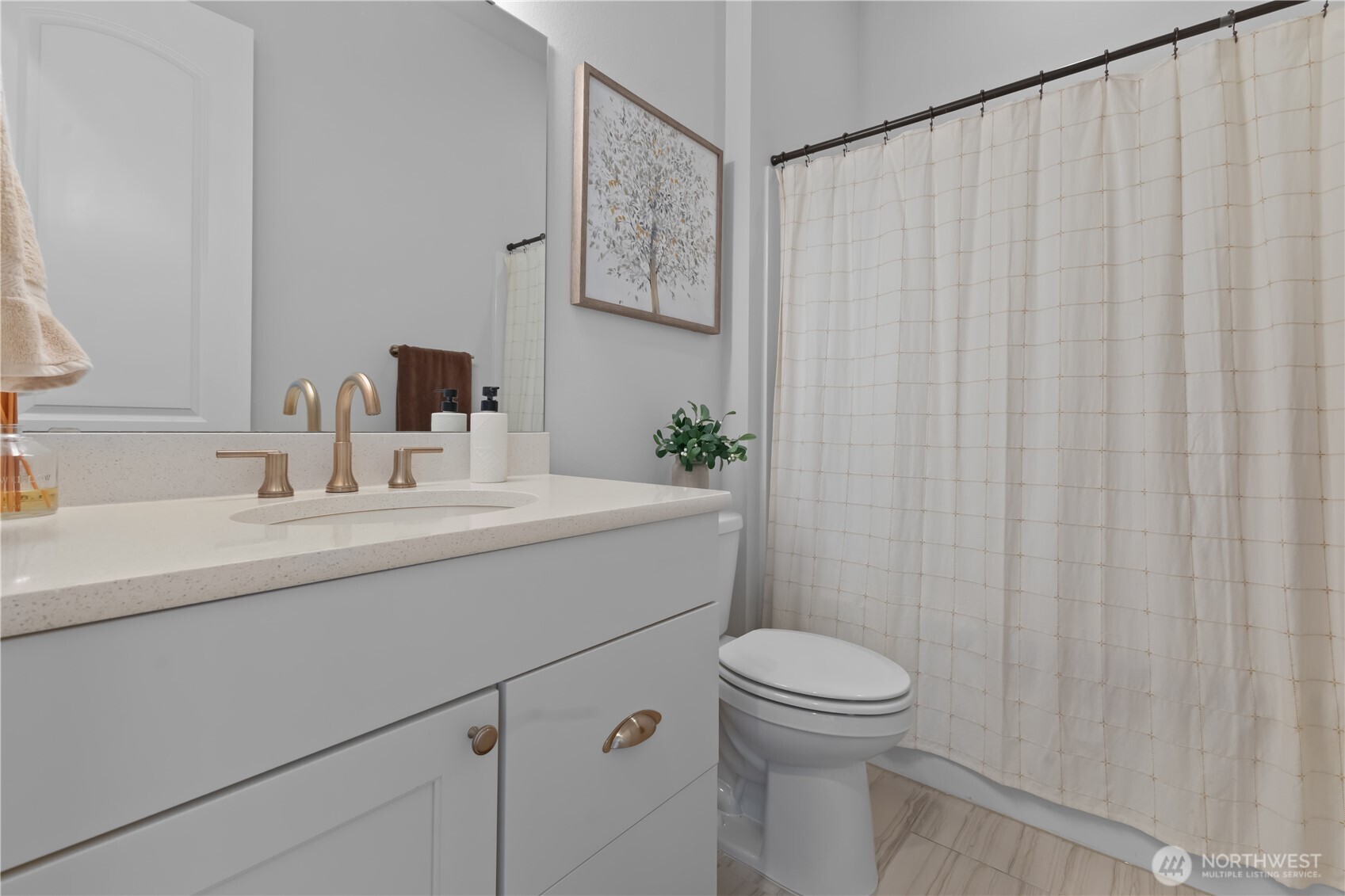 630 South Knowles Street Buckley, WA 98321 - Photo 18 of 29 a bathroom with a sink a toilet and shower curtain