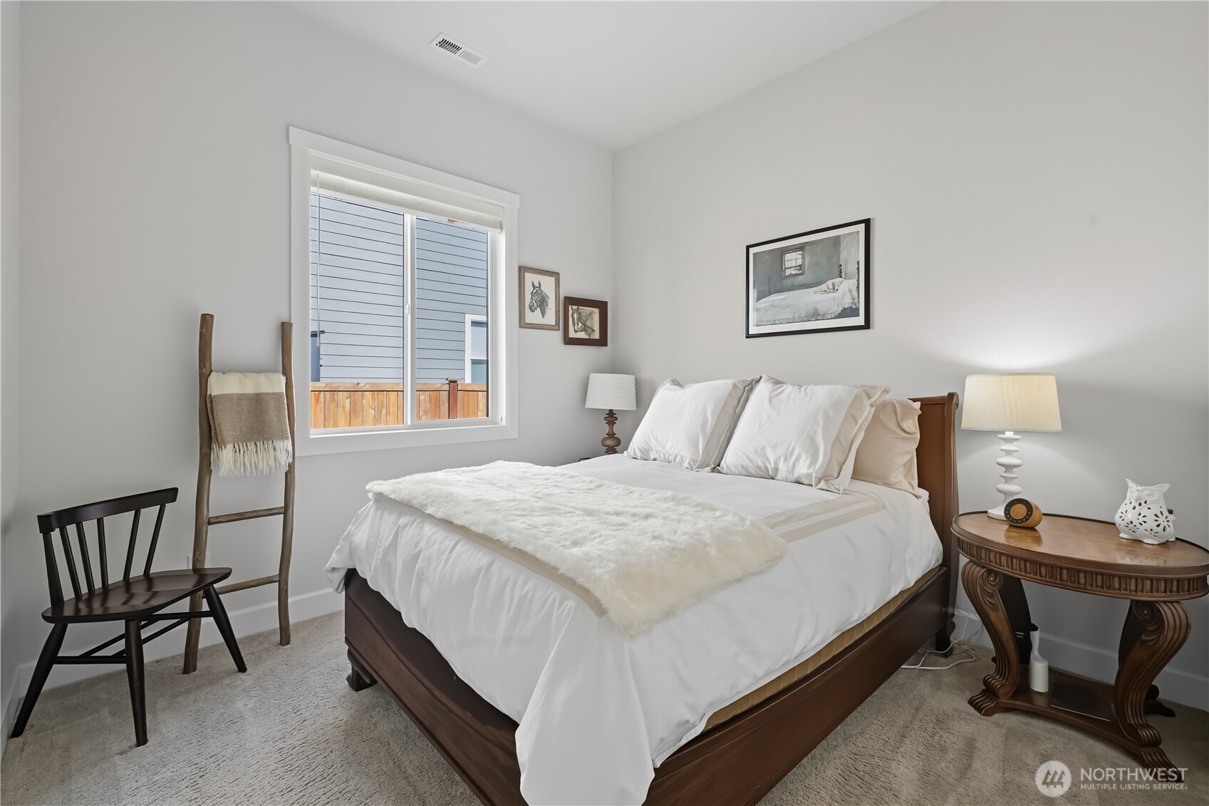 630 South Knowles Street Buckley, WA 98321 - Photo 20 of 29 a bedroom with a bed and a table in it