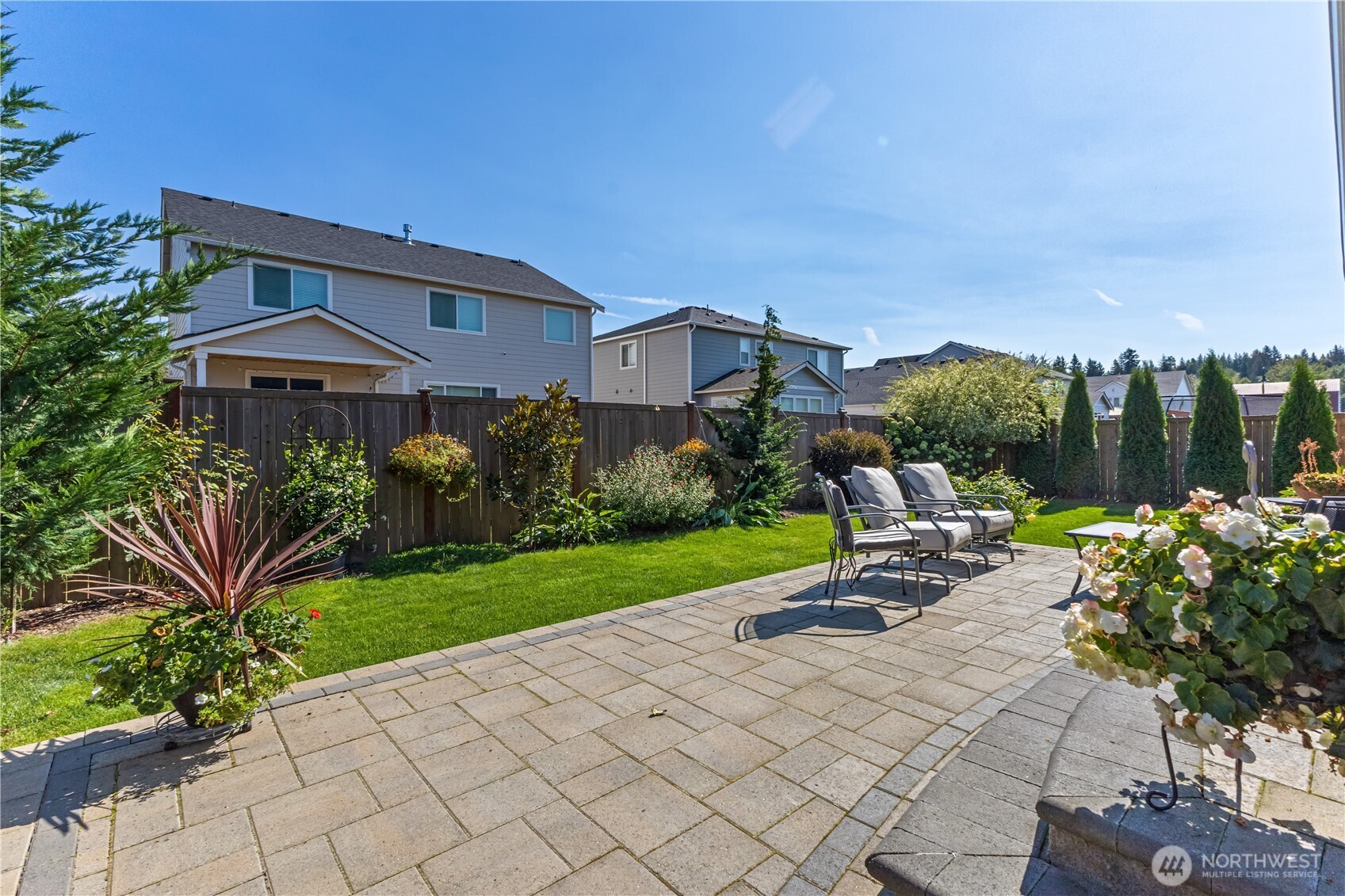 630 South Knowles Street Buckley, WA 98321 - Photo 24 of 29 a view of a patio with a table and chairs under an umbrella