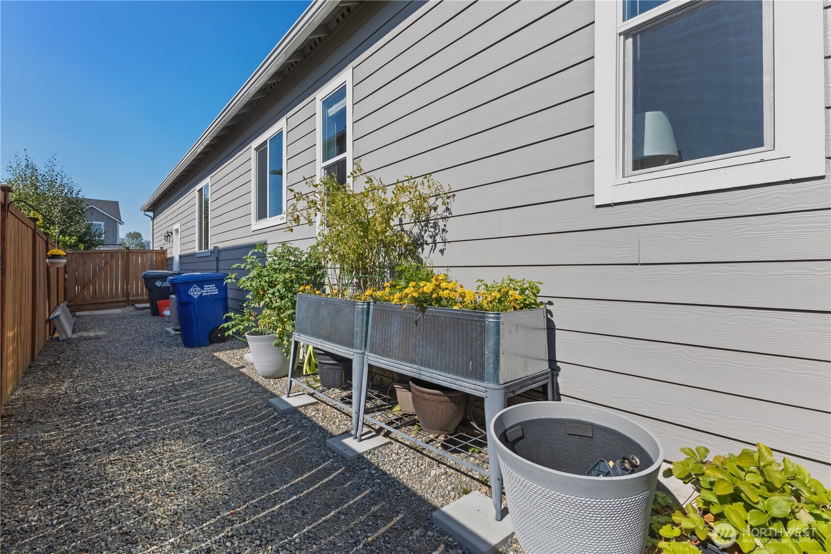 630 South Knowles Street Buckley, WA 98321 - Photo 26 of 29 a wooden bench sitting in front of a house
