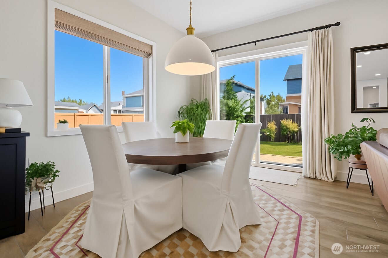 630 South Knowles Street Buckley, WA 98321 - Photo 8 of 29 a view of a dining room with furniture window and wooden floor