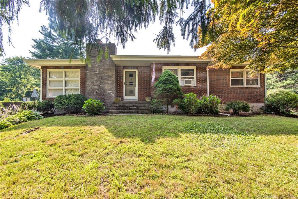 128 Snake Meadow Road Killingly, CT 06239 - Photo 1 of 1 a front view of a house with garden