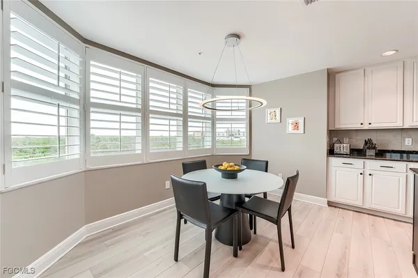 a view of a dining room with furniture window and outside view